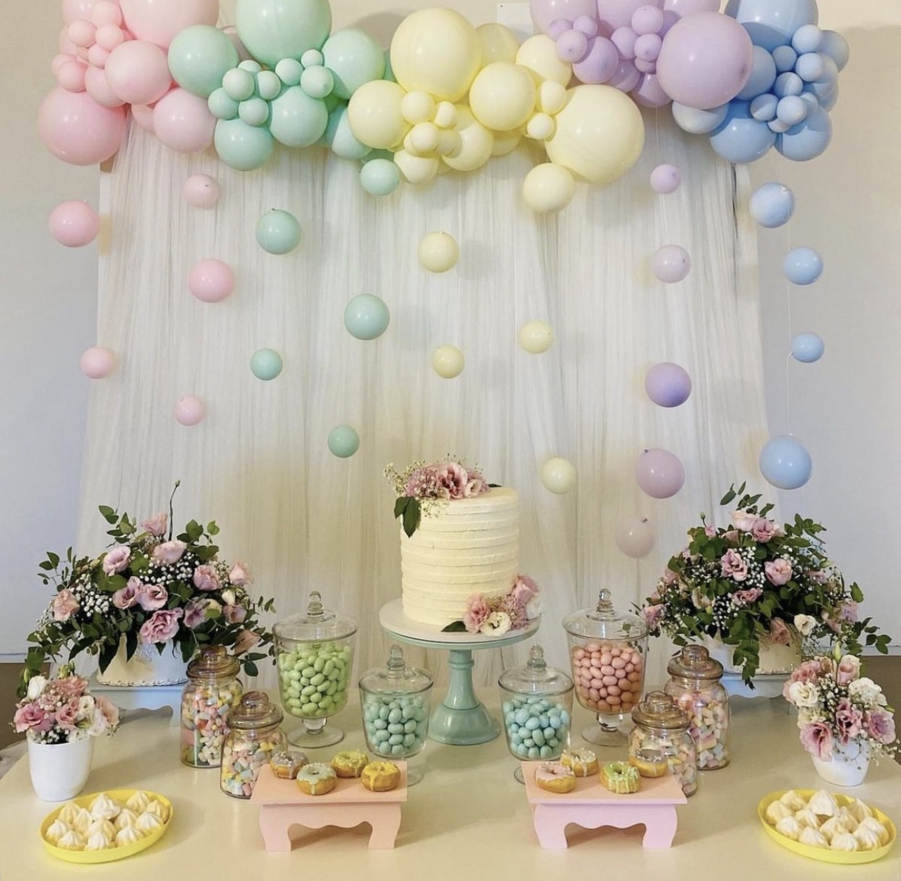 Pastel balloon garland and dessert table