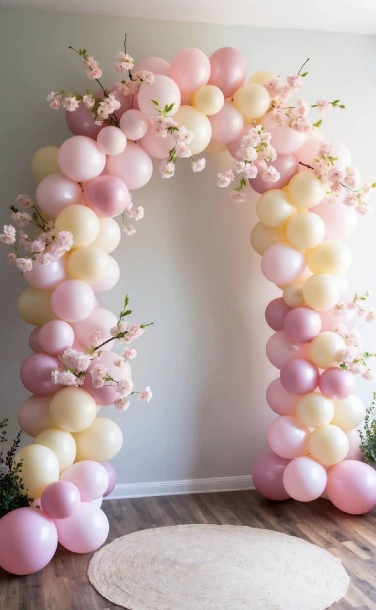 Pastel pink and yellow balloon arch
