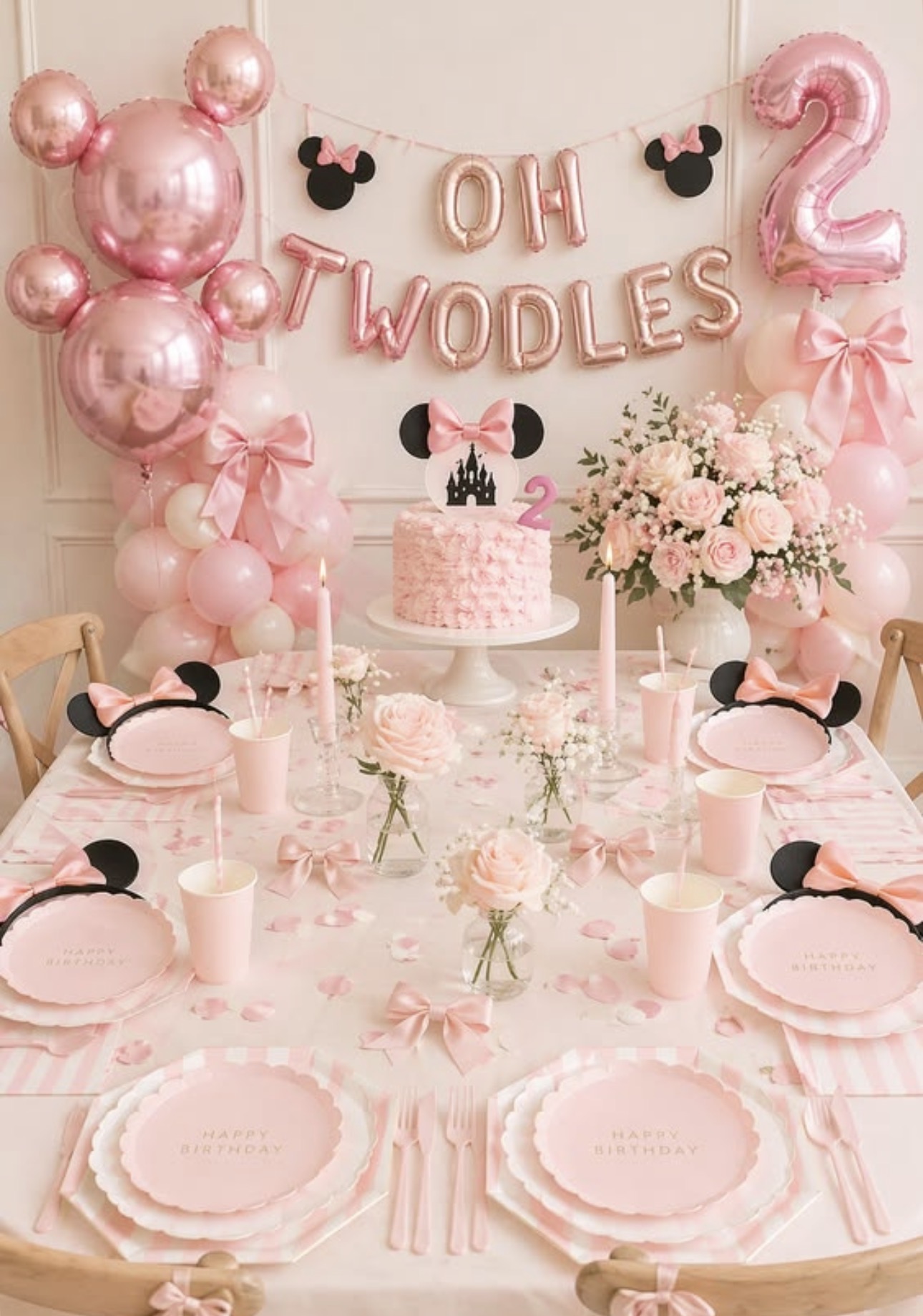 Pink birthday table with balloon details and bow accents