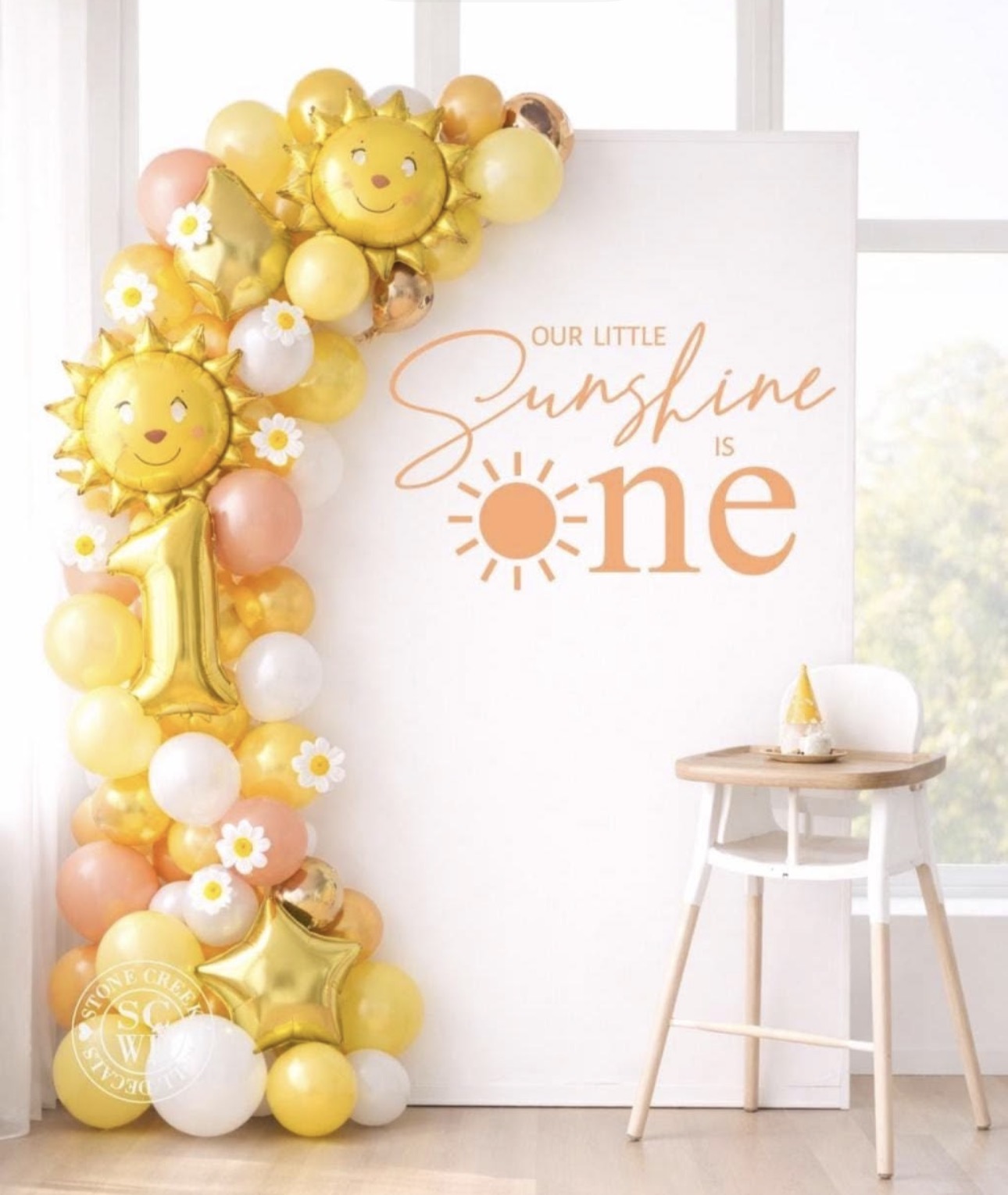 Sunshine first birthday backdrop with yellow balloons