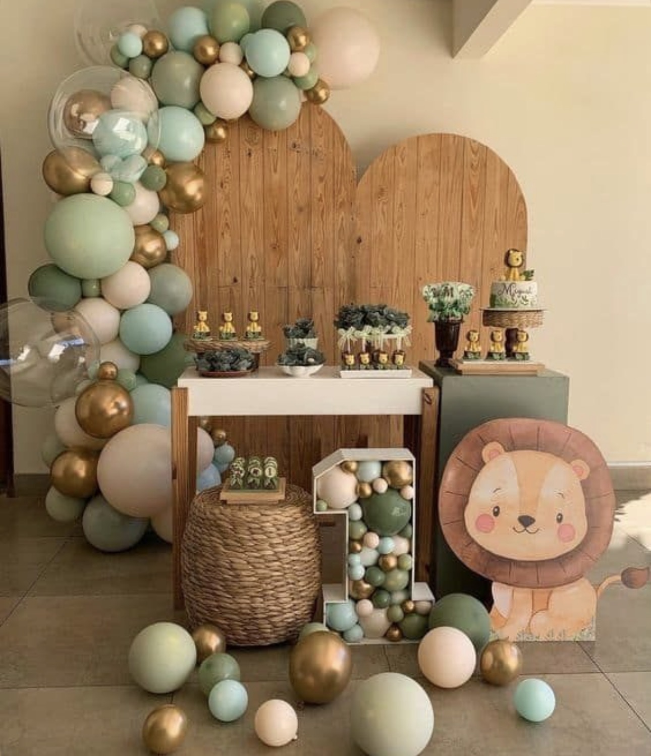 Wooden backdrop with sage and gold balloon garland
