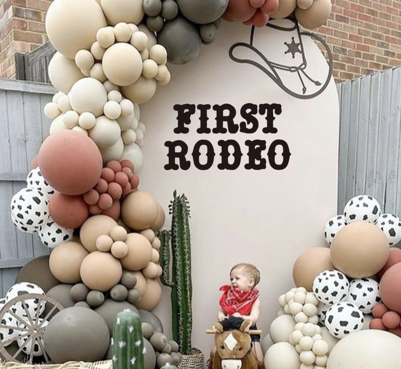 Western first birthday backdrop with balloons