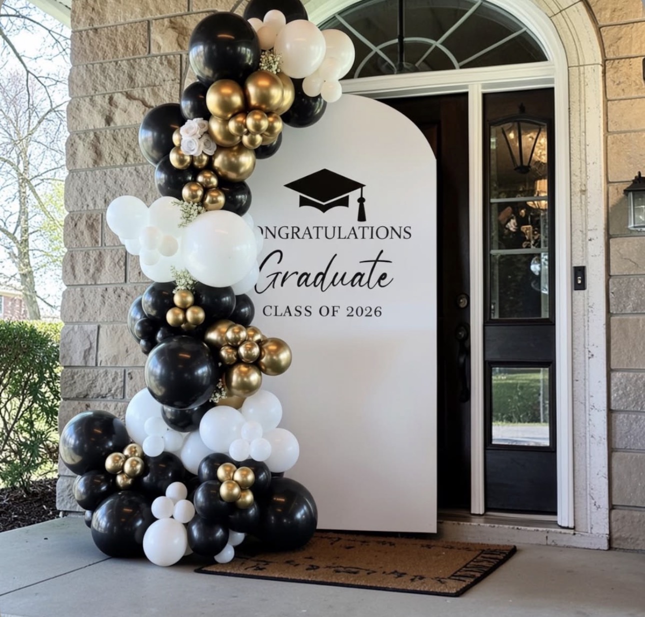 Black and gold graduation balloon backdrop