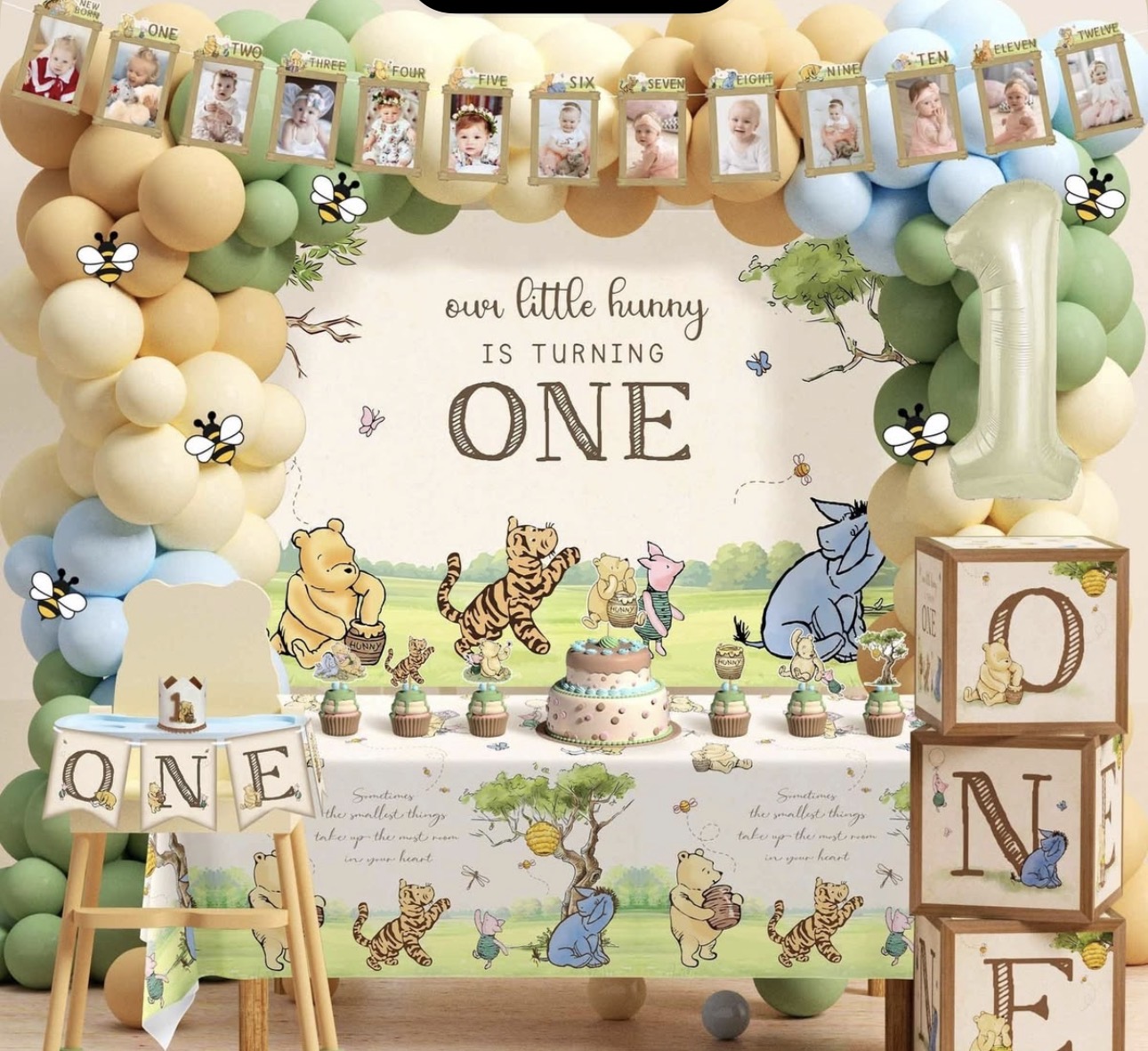 Storybook first birthday dessert table with balloon arch