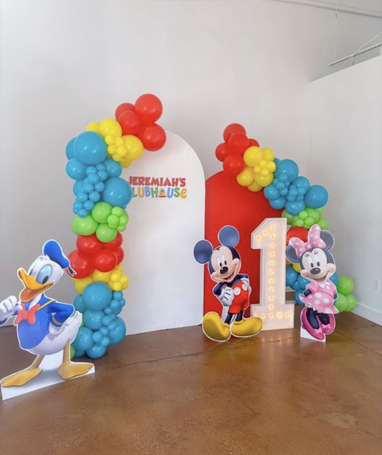 Bright character-themed backdrop with marquee number