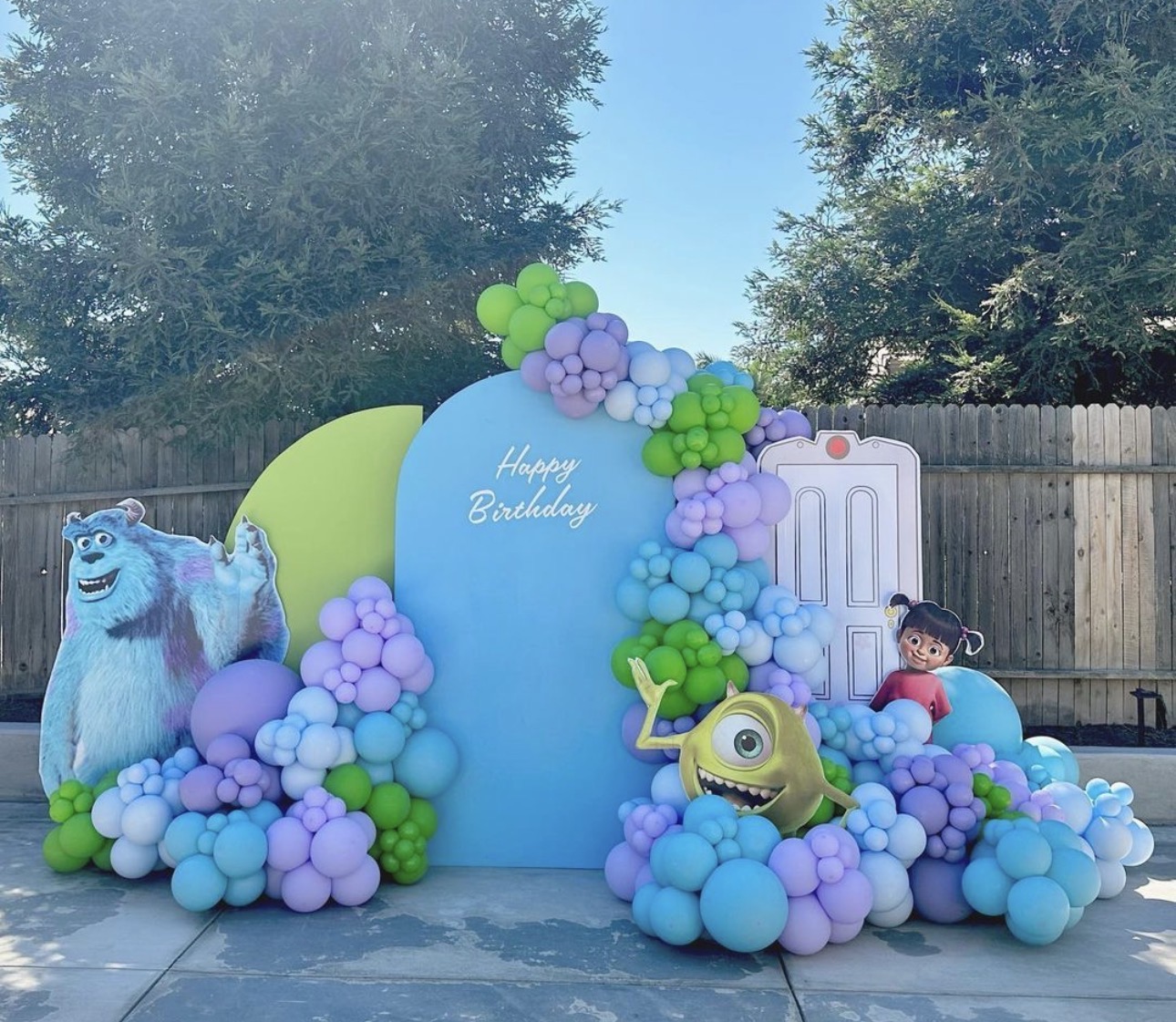 Blue and purple character-themed balloon backdrop